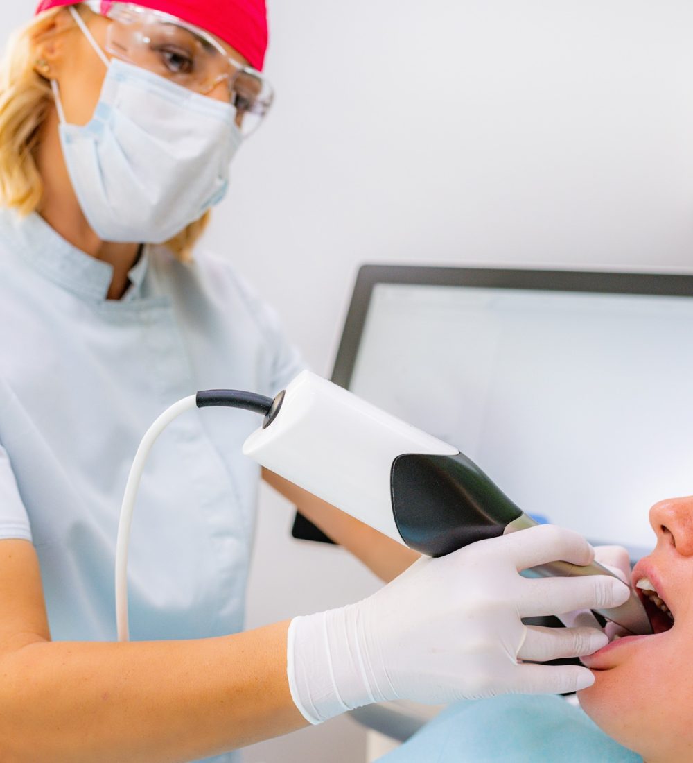Dental Prosthodontics. Dentist Using 3D Camera in Teeth Reconstruction Procedure Dental Prosthodontics. Dentist Using 3D Camera in Teeth Reconstruction Procedure